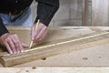 Craftsman measuring wood