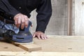 Craftsman orbital sanding oak wood Royalty Free Stock Photo