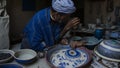 Craftsman painting crockery in Hebron, West Bank, Palestine