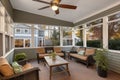 craftsman porch with ceiling fans and large windows