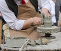 Craftsman potter shaping clay to make a beautiful vase handmade