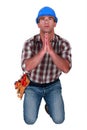 Craftsman praying Royalty Free Stock Photo