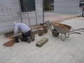 Craftsman relocates paving stones Royalty Free Stock Photo