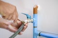 Craftsman repairing a leaky faucet on the kitchen sink Royalty Free Stock Photo