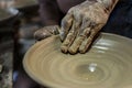 Craftsman\'s hand creating the art of ceramics in a pottery. Maragogipinho, Bahia, Brazil