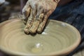 Craftsman\'s hand creating the art of ceramics in a pottery. Maragogipinho, Bahia, Brazil