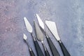 Craftsman`s tools, artistic palette knives of various shapes and sizes