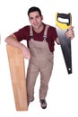 Craftsman with saw Royalty Free Stock Photo