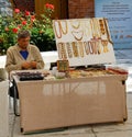 Craftsman sells jewelry made of amber near Museum of Amber in Kaliningrad Royalty Free Stock Photo