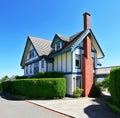 Craftsman style American house exterior with white and blue trim.