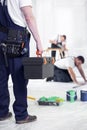 Craftsman with toolbox during work of home renovation crew Royalty Free Stock Photo