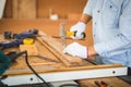 Craftsman using hammer hobnailed in workshop, Carpenter using the hammer hit a nail for assembly wood in a carpentry workshop Royalty Free Stock Photo