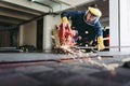 Craftsman Welding is Cutting Steel Work in Fabrication Workshop, Welder Man in Safety Protective Equipments Doing Metalwork in Royalty Free Stock Photo