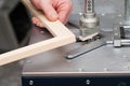 Craftsman working on frame in frame shop. Professional framer hand holding frame angle. Top view. Copy space Royalty Free Stock Photo