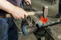 A craftsman working with a hammer and anvil Royalty Free Stock Photo
