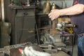 A craftsman working with a hammer and anvil Royalty Free Stock Photo