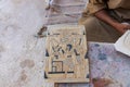 Craftsman working on a reproduction of a tablet with Egyptian hieroglyphics in Luxor, Egypt Royalty Free Stock Photo