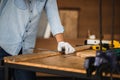 Craftsman works on workbench, Carpenter working on woodworking machines in carpentry shop