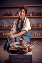 Pottery master demonstrates a finished clay bowl in the workshop . Making pottery.