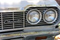 Monterey, CA, USA - 18 Aug 2022: Macro, twin headlamps on an antique Chevrolet during Classic Car Week.