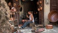 Craftsmen in the Medina o Fez city working traditional handycrafts, Morocco