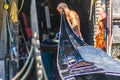 Craftsmen repair the famous Venetian gondolas by hand in a traditional gondola shipyard in Venice.