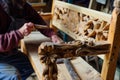 craftsperson assembling a handcarved pine bench