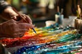 Craftsperson creating colorful glass art in a studio