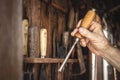 Craftsperson holding chisel in hand Royalty Free Stock Photo