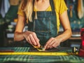 Craftsperson Measuring Fabric