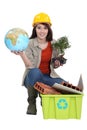 Craftswoman posing with recycling tub Royalty Free Stock Photo