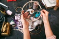 Craftswoman shows Dreamcatcher.