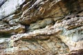 Ledge textures - yellowish craggy rock formation Royalty Free Stock Photo