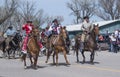 Rex Walker owner of Sombrero Ranch and Miss Colorado Rodeo 2018 riding their horses down main street in Maybell, Royalty Free Stock Photo