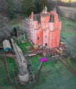 Craigievar Castle during conservation work to paint the walls pink