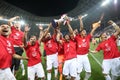 Members of CFR Cluj soccer team celebrate winning the Supercup