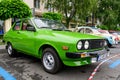 Craiova, Romania, 29 May 2022: Old vivid green Romanian Dacia 1310 classic car produced in year 1987 in a street in the city