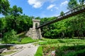 Craiova, Romania, 28 May 2022: Renovated suspended metallic bridge in Nicolae Romaescu park from Craiova in Dolj county, Romania,
