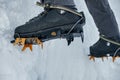 Crampons close-up on his feet ice climber, climber on a frozen w