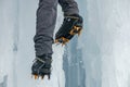 Crampons close-up on his feet ice climber, climber on a frozen waterfall.