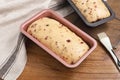 Cranberry bread dough in pink loaf pan
