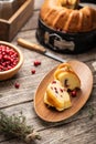 Cranberry bundt wreath cake served on wooden plate. Royalty Free Stock Photo