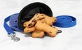 Cranberry dog cookies in a training bag with a leash Royalty Free Stock Photo