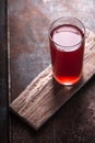 Cranberry drink in a glass on the tabie Royalty Free Stock Photo