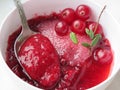 Cranberry jam with sugar in a white bowl