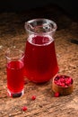 Cranberry juice in glass with fresh berry on wooden background Royalty Free Stock Photo