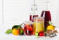 Cranberry juice, honey, mandarins on white table Royalty Free Stock Photo