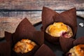 Cranberry orange muffins in brown tulip muffin liners