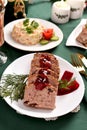 Cranberry pate and other traditional Christmas Eve dishes on festive table Royalty Free Stock Photo