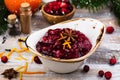 Cranberry sauce with ingredients on wooden table Royalty Free Stock Photo